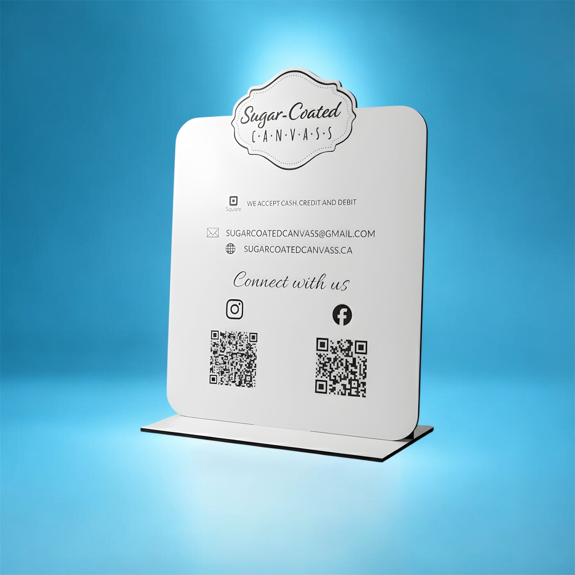 White sign with branding and contact information on a blue background